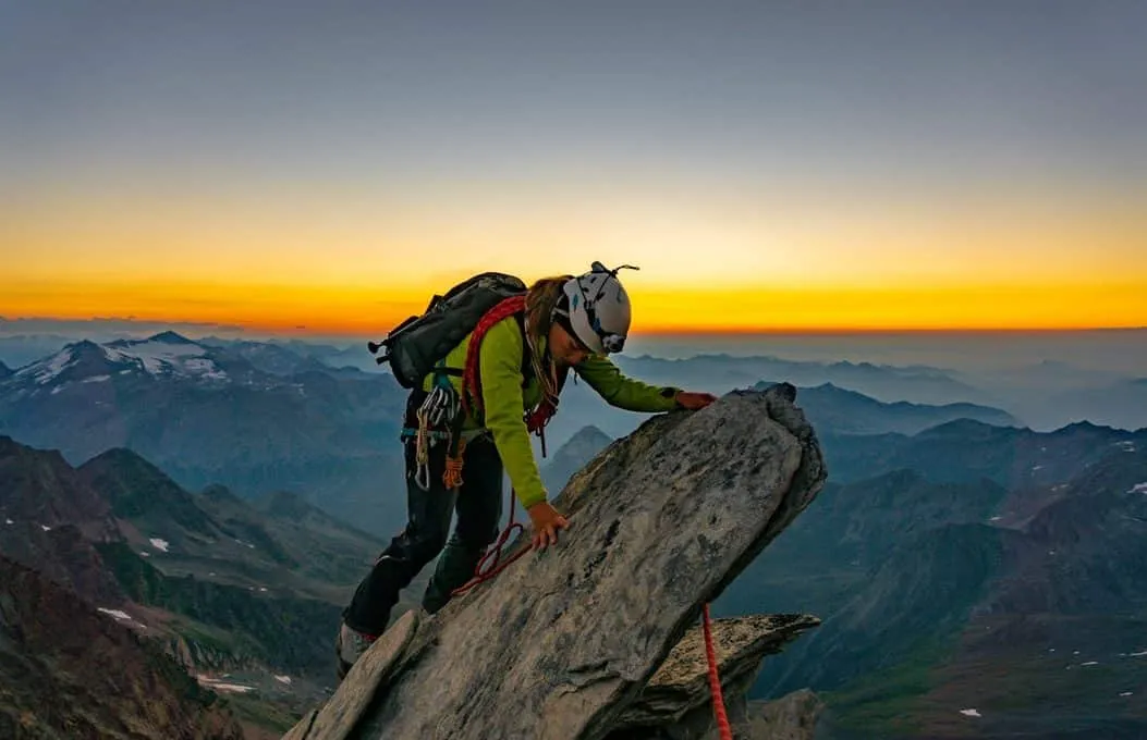 Emergency whistle and headlamp on dark pack fabric